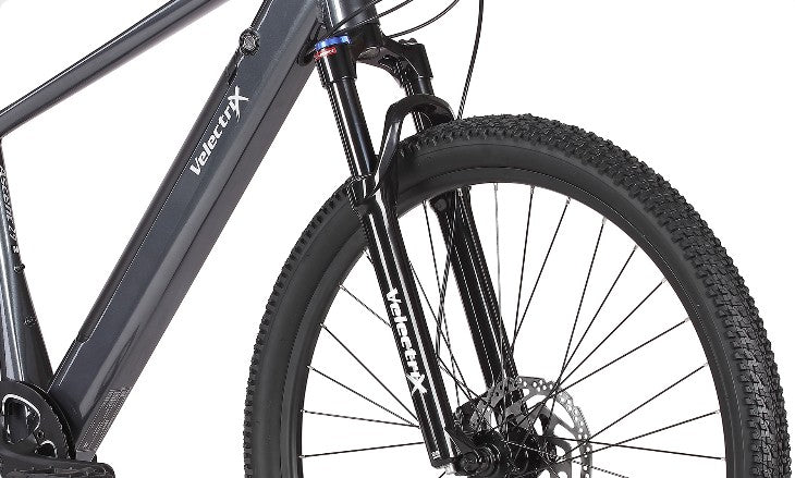The 100mm travel fork absorbs bumps and shocks, providing a smooth, controlled ride whether you’re navigating off-road trails or uneven city streets. Ride confidently, no matter the terrain with our adventure electric mountain bike.